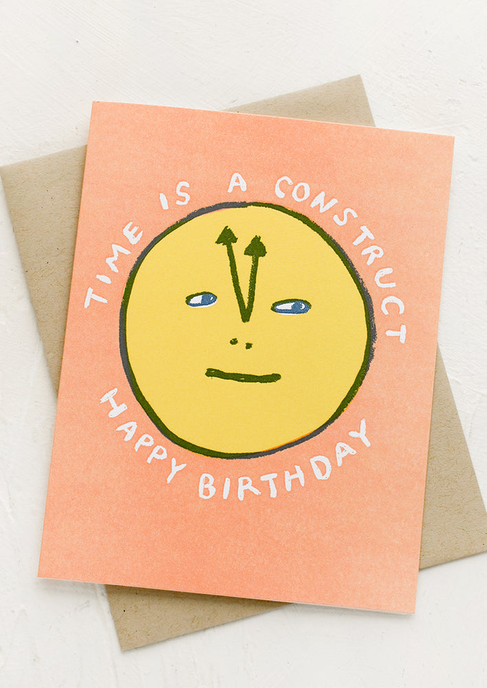 A greeting card reading "Time is a construct, happy birthday".