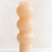 Large / Petal: A large hourglass shaped pillar candle with waxy finish in petal.