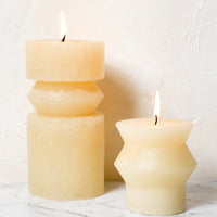 Medium (Ridge) / Vanilla: Vanilla colored pillar candles in assorted sizes.