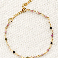 2: A gold wire bracelet with small multicolor tourmaline beads.