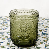 Olive Leaf: An olive green glass tumbler with floral embossed motif.