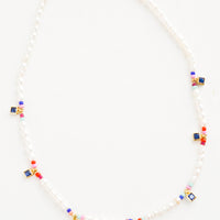 1: Beaded pearl necklace accented with square blue crystal stations and colored seed beads