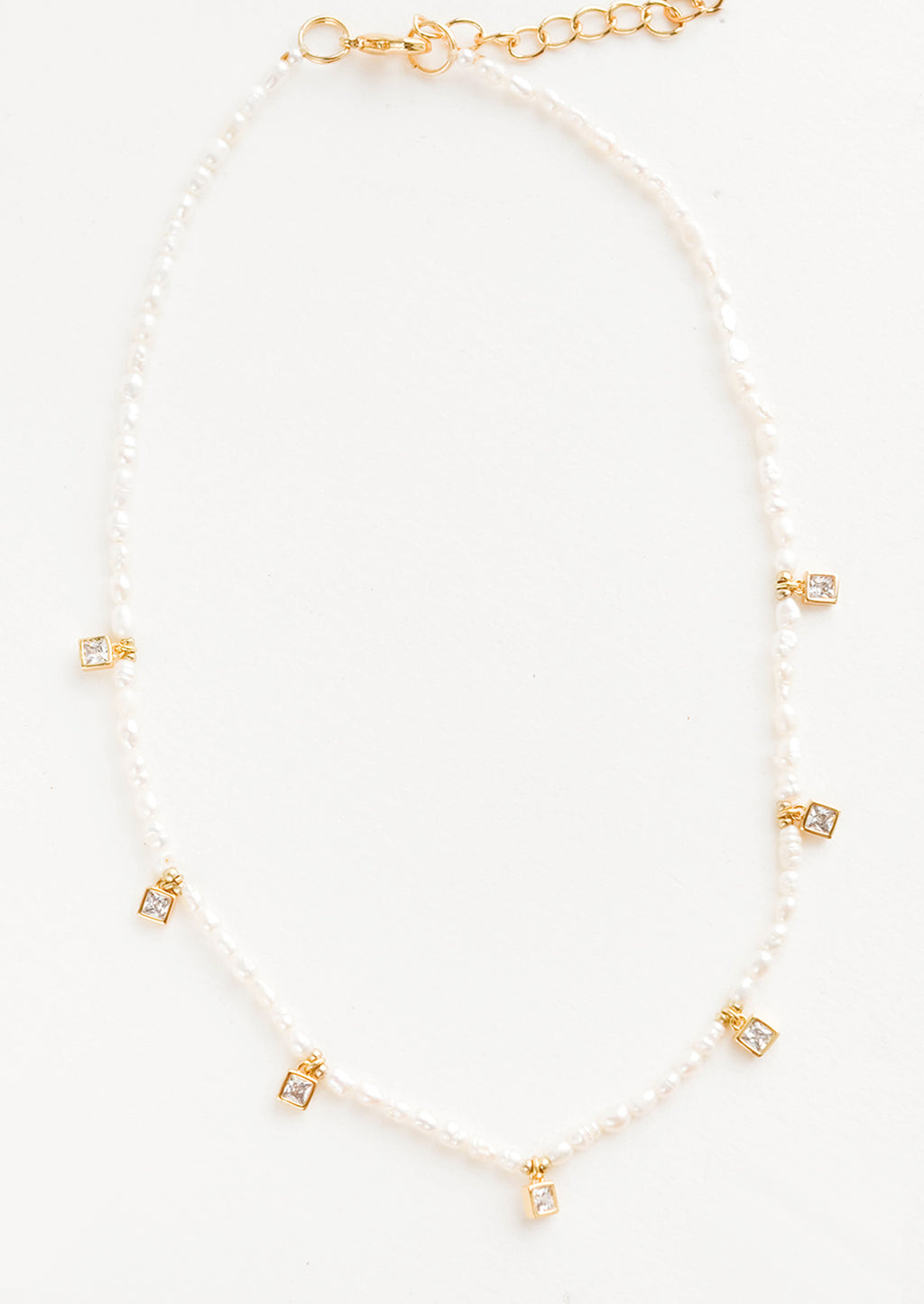 White / Gold: Pearl beaded necklace, accented with square crystal stations