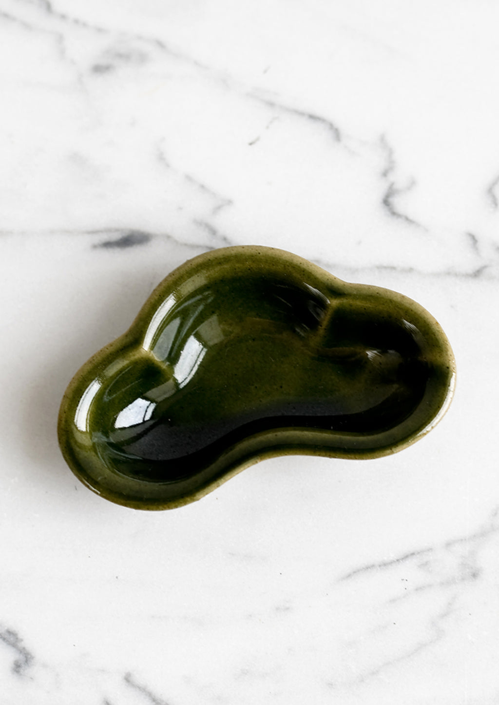 1: A small ceramic dish in cloud shape and glossy olive green glaze.