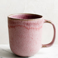 1: A purple ceramic mug with mottled glaze appearance.