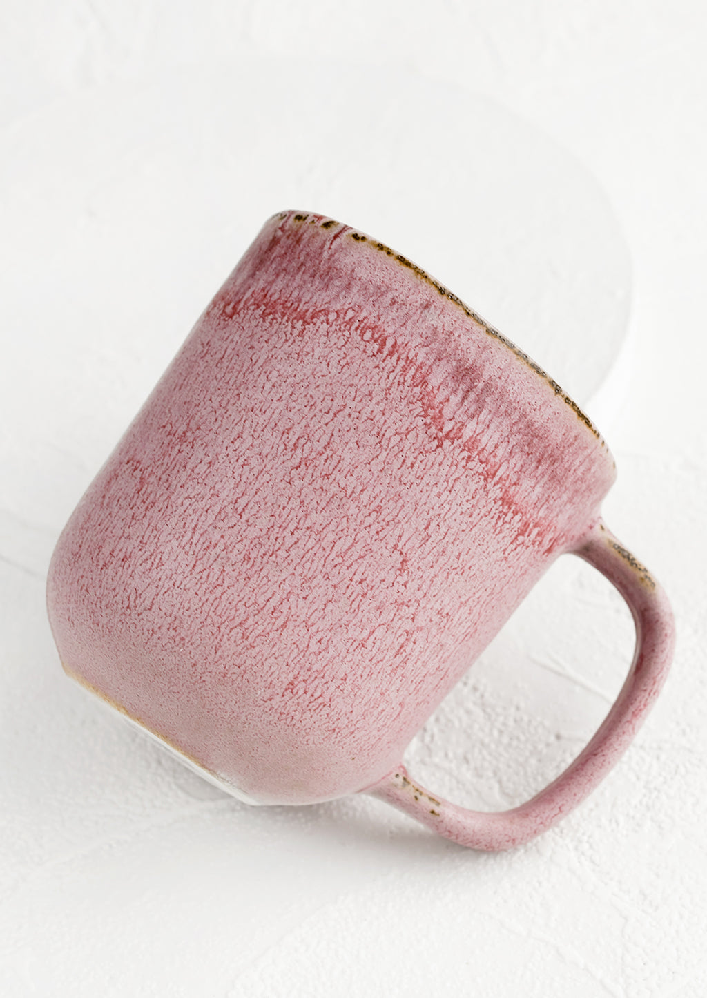 2: A purple ceramic mug with mottled glaze appearance.