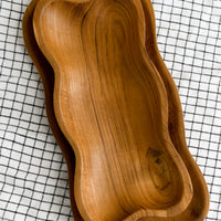 1: Rectangular teakwood tray/bowls with wavy edges.