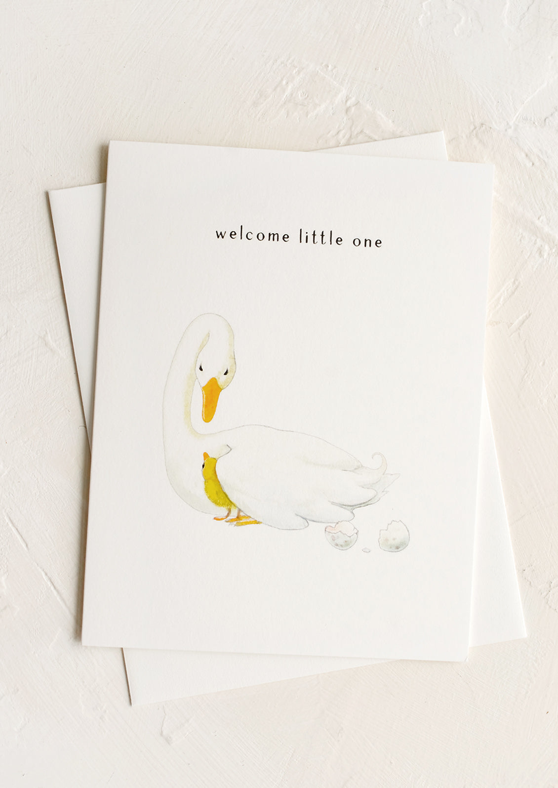 A greeting card with illustration of mother goose and chick, text at top reads "welcome little one".