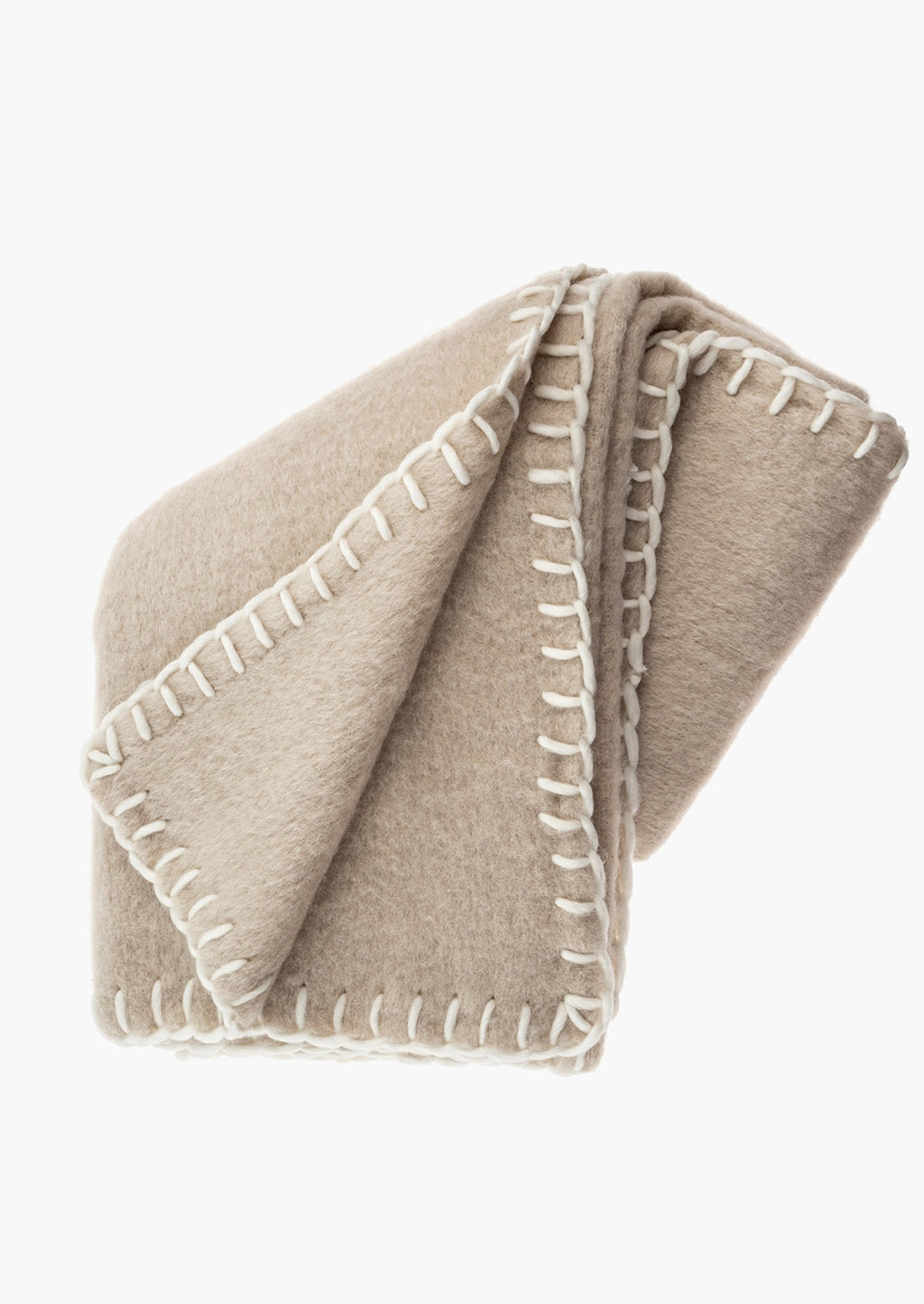 Oat: A beige mohair blanket with white yarn whipstitched trim.