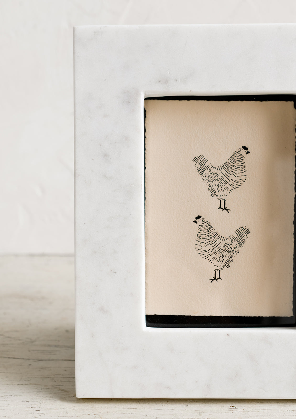 A white marble picture frame.