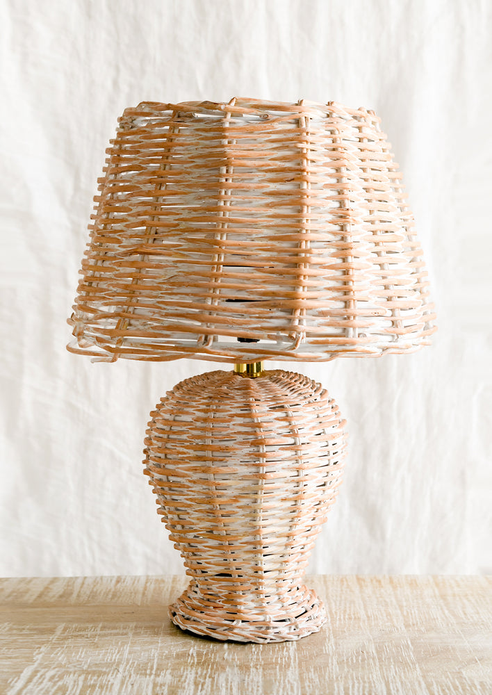 1: A woven wicker table lamp.