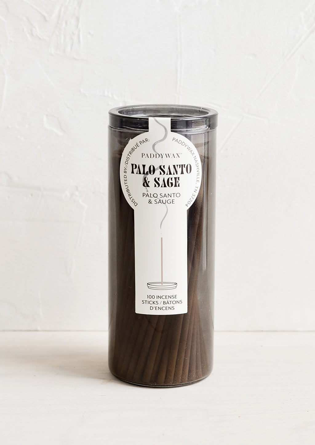 Palo Santo & Sage: A grey glass jar with incense sticks in palo santo scent.