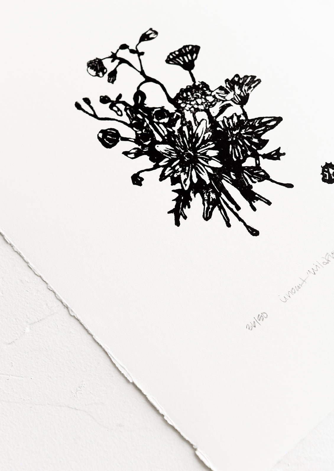 A linocut art print in black and white floral.