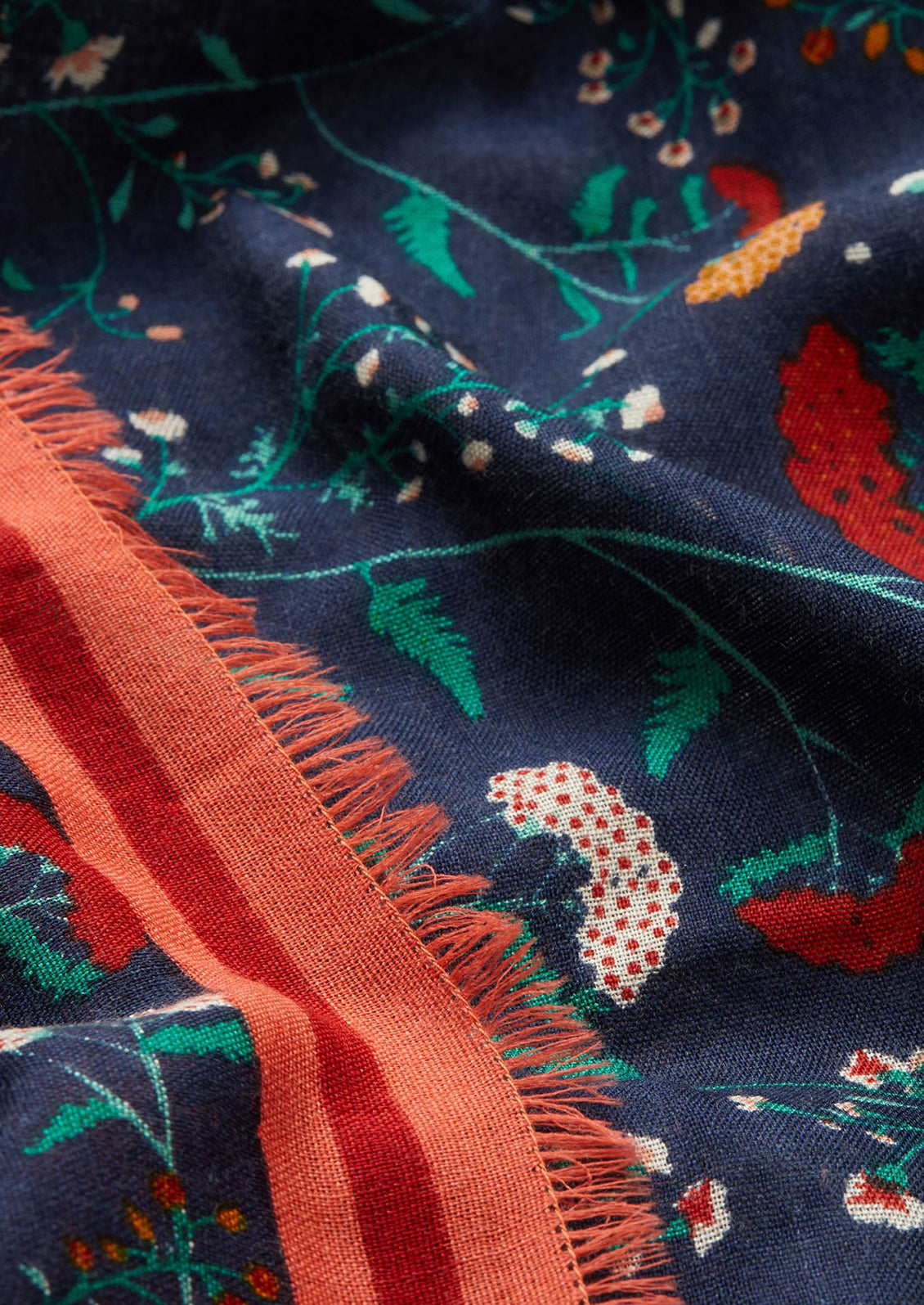 A navy blue and red scarf in wildflower print.