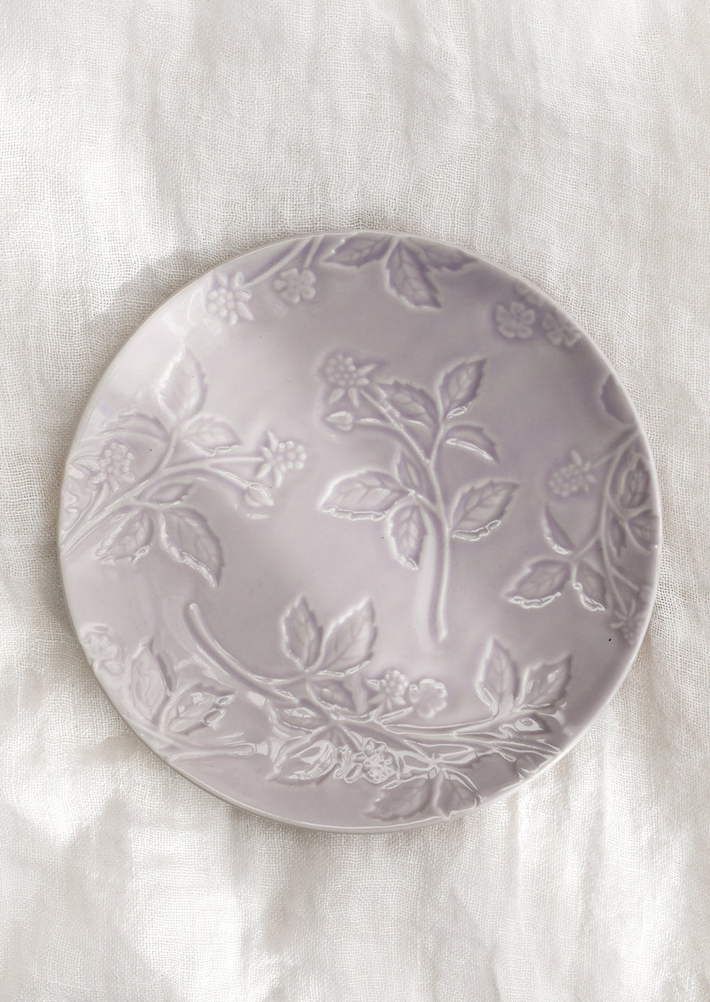 Pale Lavender: A round ceramic dessert plate in lavender with tonal raspberry pattern.