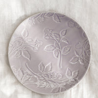 Pale Lavender: A round ceramic dessert plate in lavender with tonal raspberry pattern.