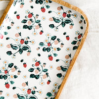 2: A rectangular wooden tray with white strawberry enamel pattern.