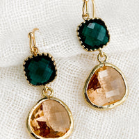 Emerald / Peach: A pair of two-stone bezeled gem earrings in emerald and blush.