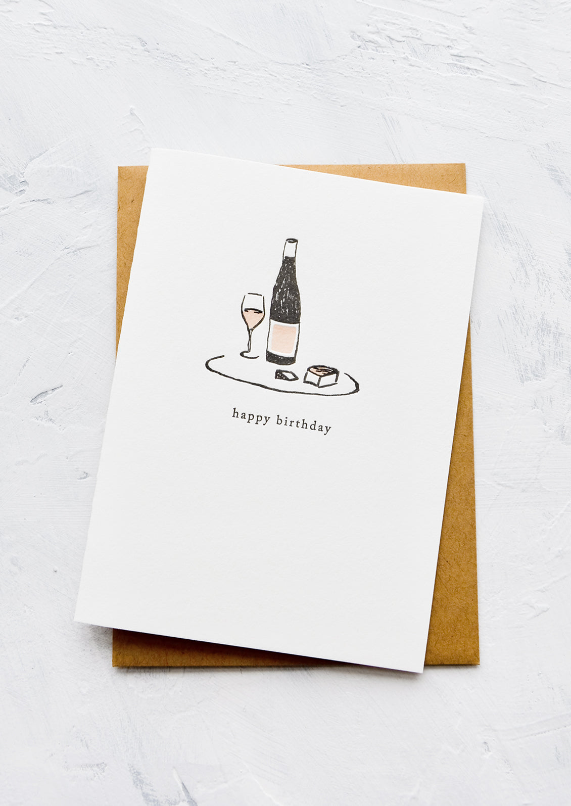 A letterpress printed greeting card with an image of a platter of wine and cheese, text below image reads "happy birthday".