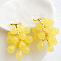 Yellow Grape: A pair of earrings in the shape of green grape bunches.