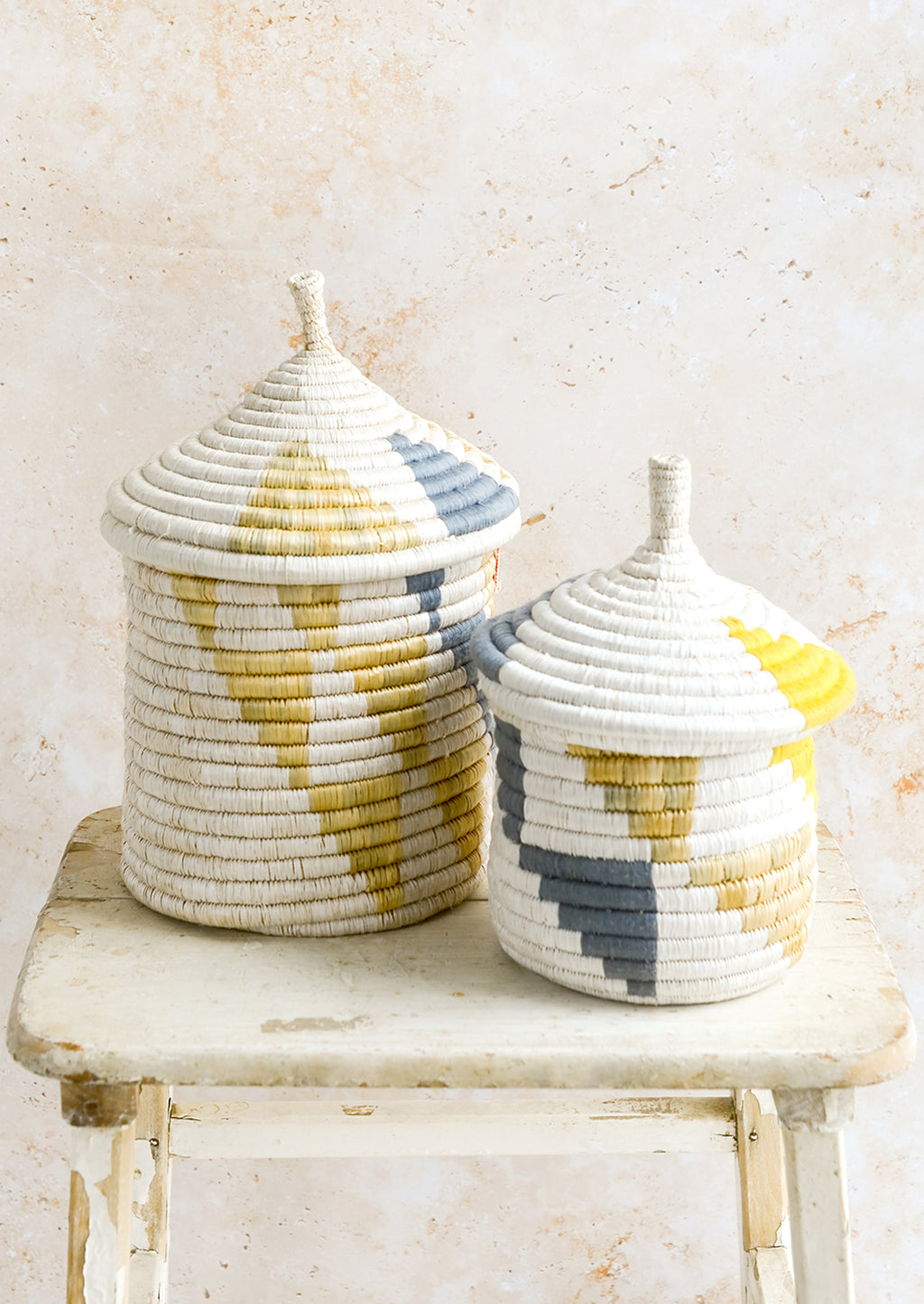 4: Woven lidded storage baskets with geometric patterns in small and medium sizes.