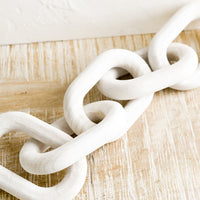Whitewash: A decorative wooden chainlink.