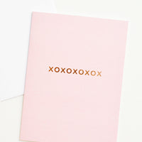 1: A pale pink greeting card with "xoxoxoxoxox" in gold foil.