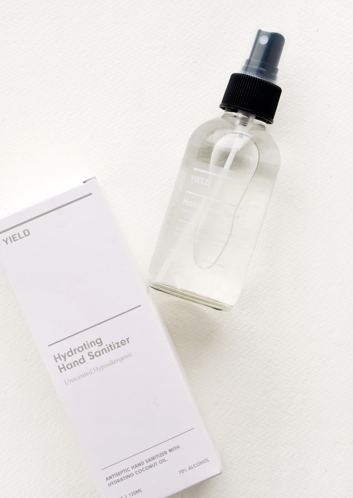 White box packaging for hand sanitizer in clear glass spray bottle