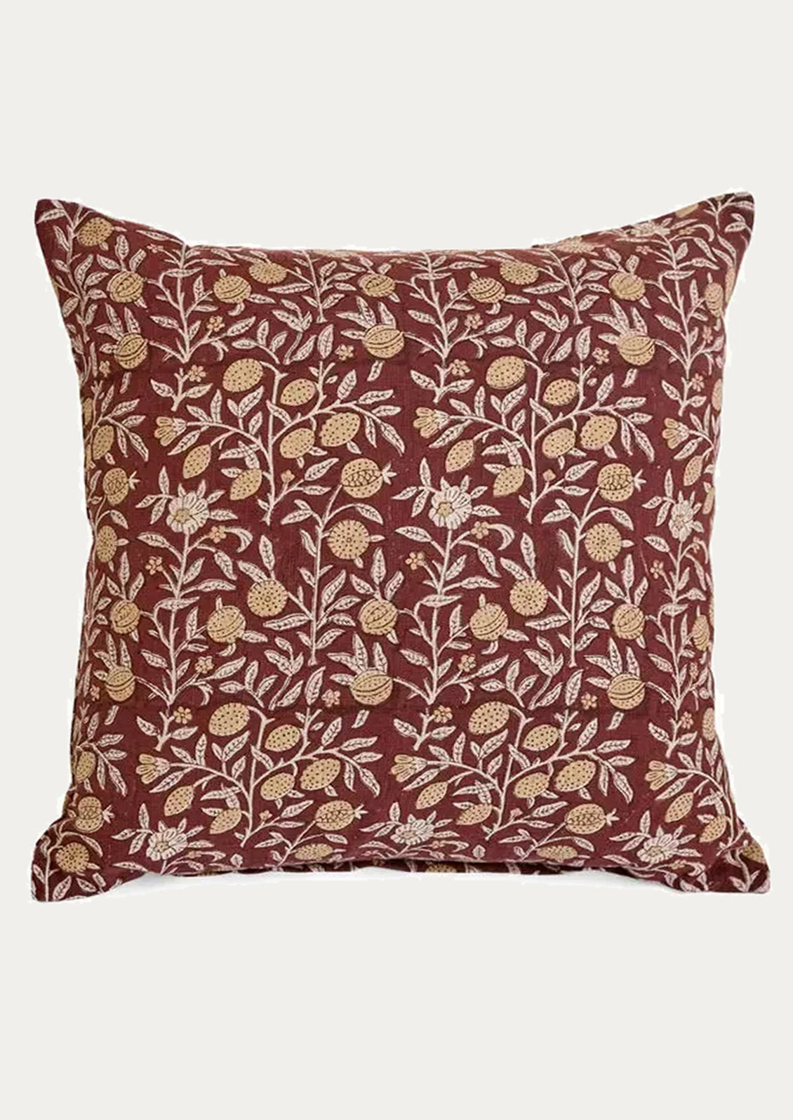 Decorative pillow with floral pattern on a plain background