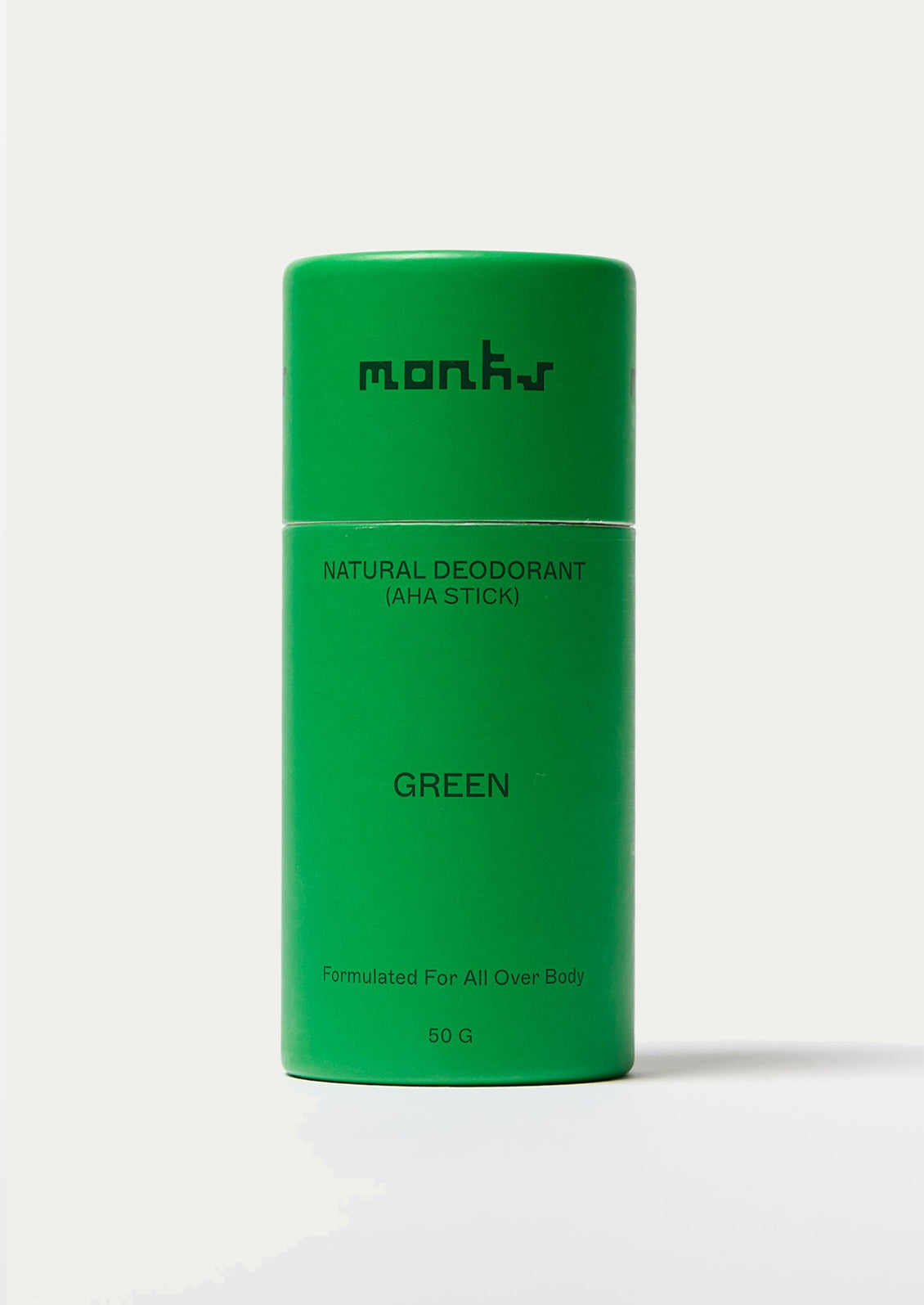 Green deodorant stick with 'mons' branding on a white background