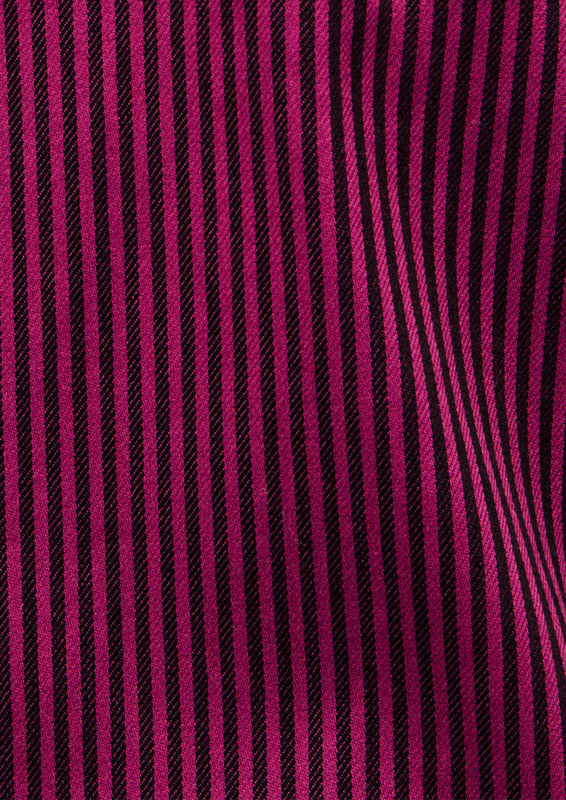 Close-up of pink and black striped fabric texture