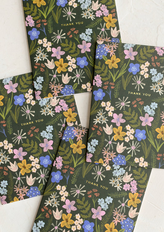 A set of thank you cards with floral print on olive green background.