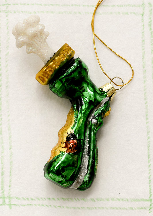 A glass holiday ornament depicting the sprayer attachment part of a garden hose.