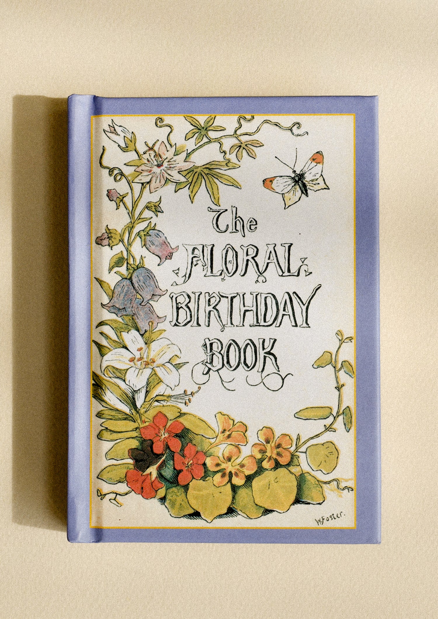 A small book titled "The Floral Birthday Book".