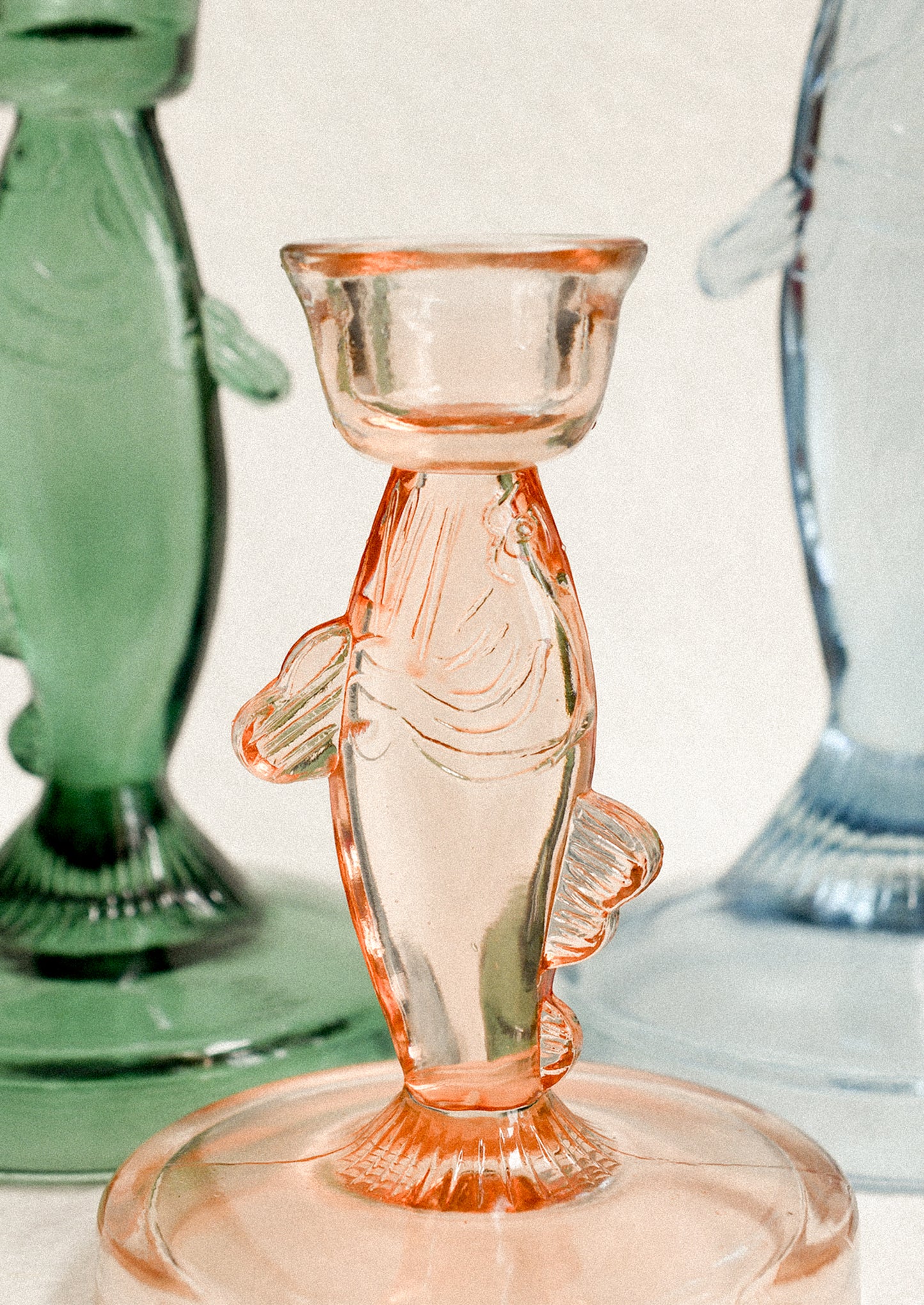 Assorted color fish shape candle holders.