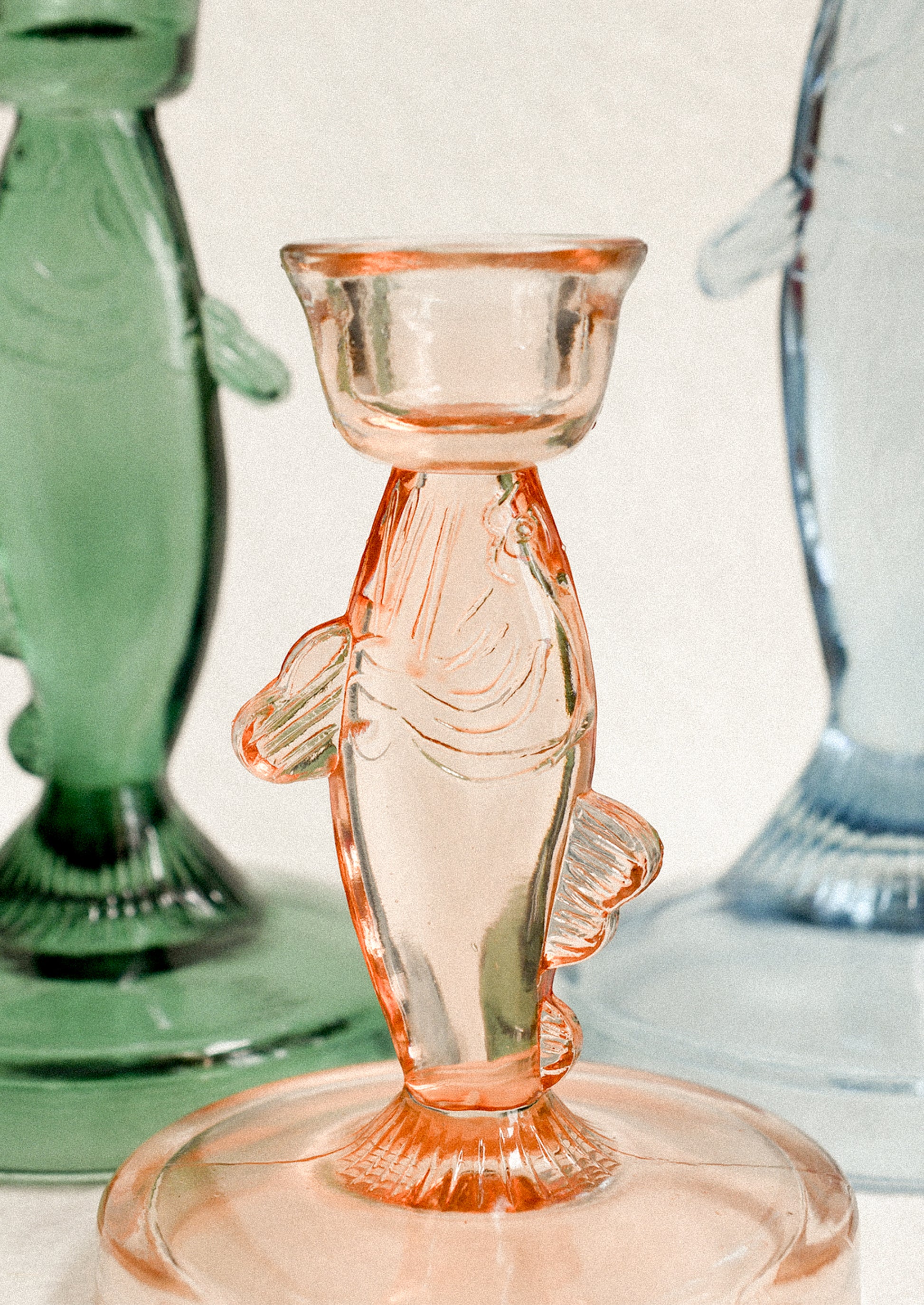 Assorted color fish shape candle holders.