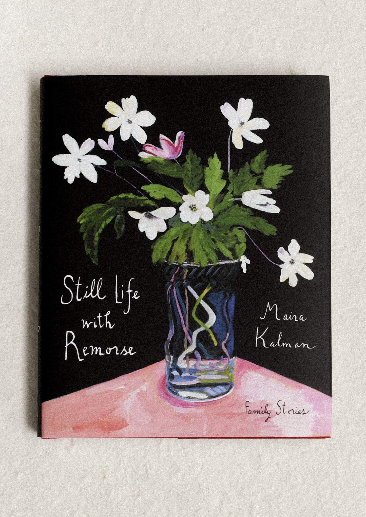 Book cover with floral illustration and text on a black background