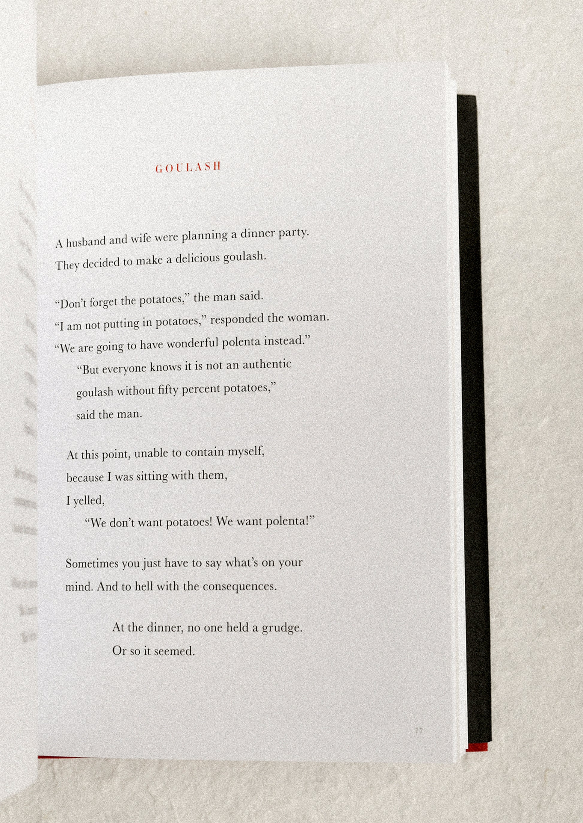 Open book with a humorous story on a textured surface