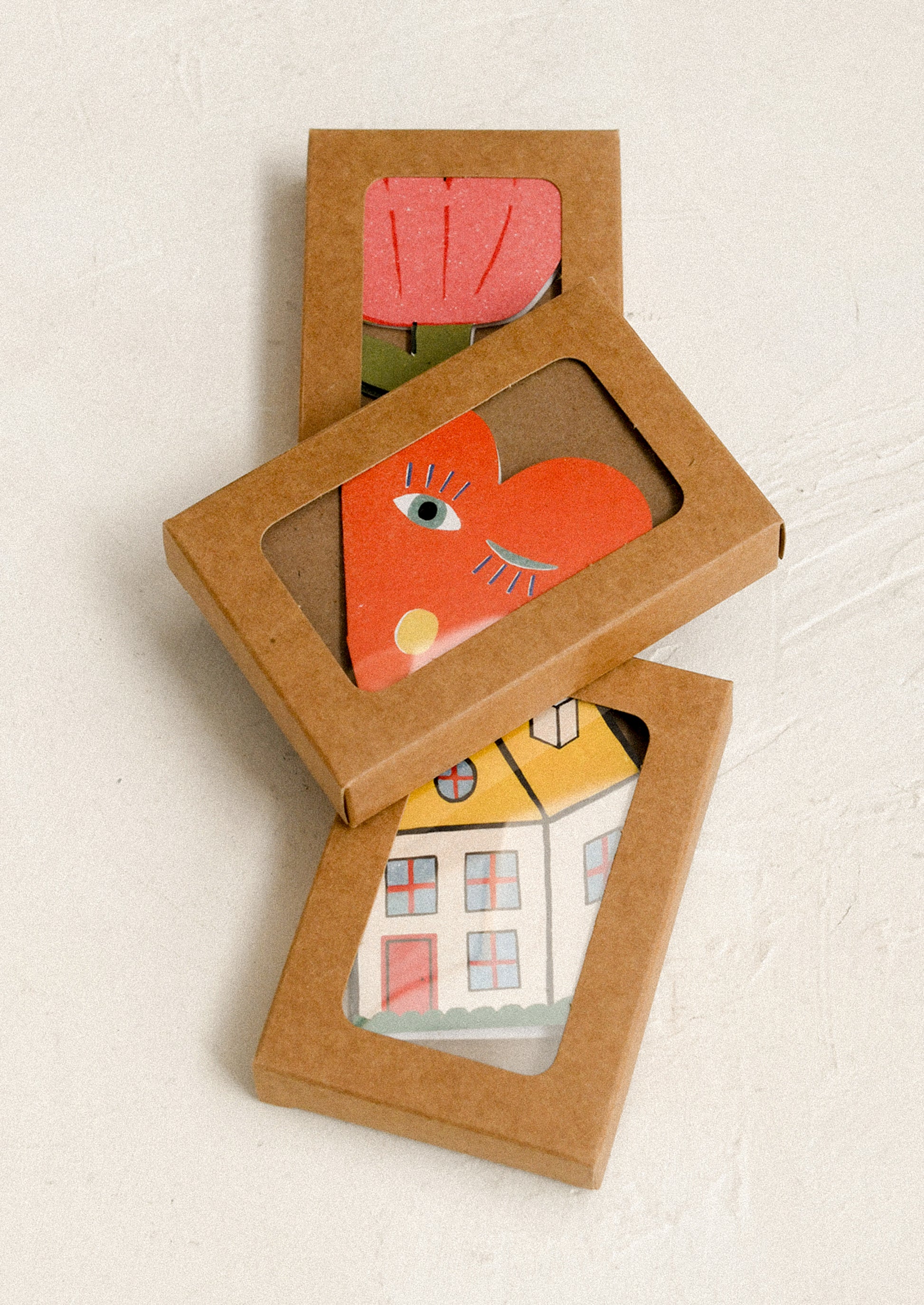 Three boxed card sets.