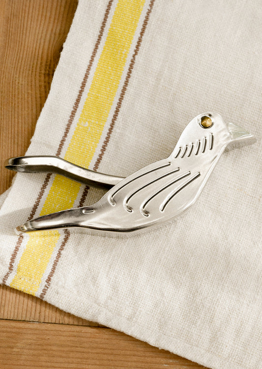A lemon squeezer device in the shape of a bird.