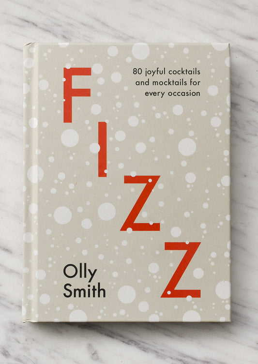 Book titled 'Fizz' by Olly Smith on a marble surface