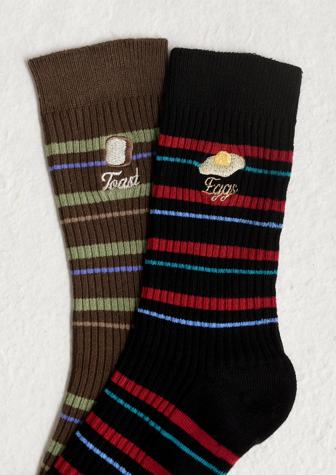 Striped socks with embroidered breakfast motifs.