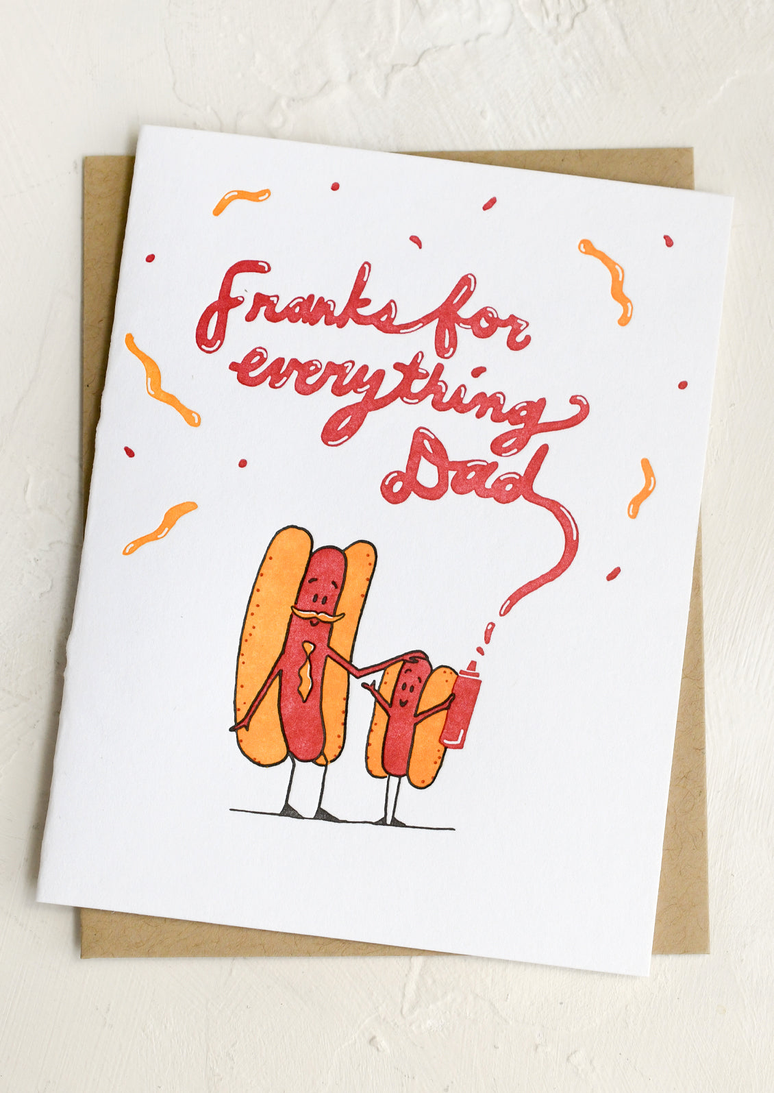 Greeting card with cartoon hot dogs and 'Thanks for everything Dad' text on a white background.