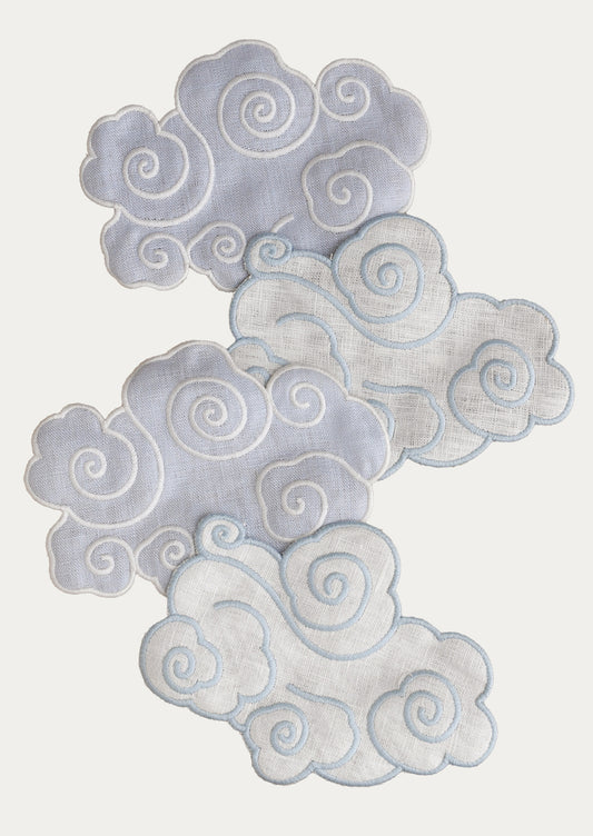 A set of four cloud-shaped linen cocktail napkins.