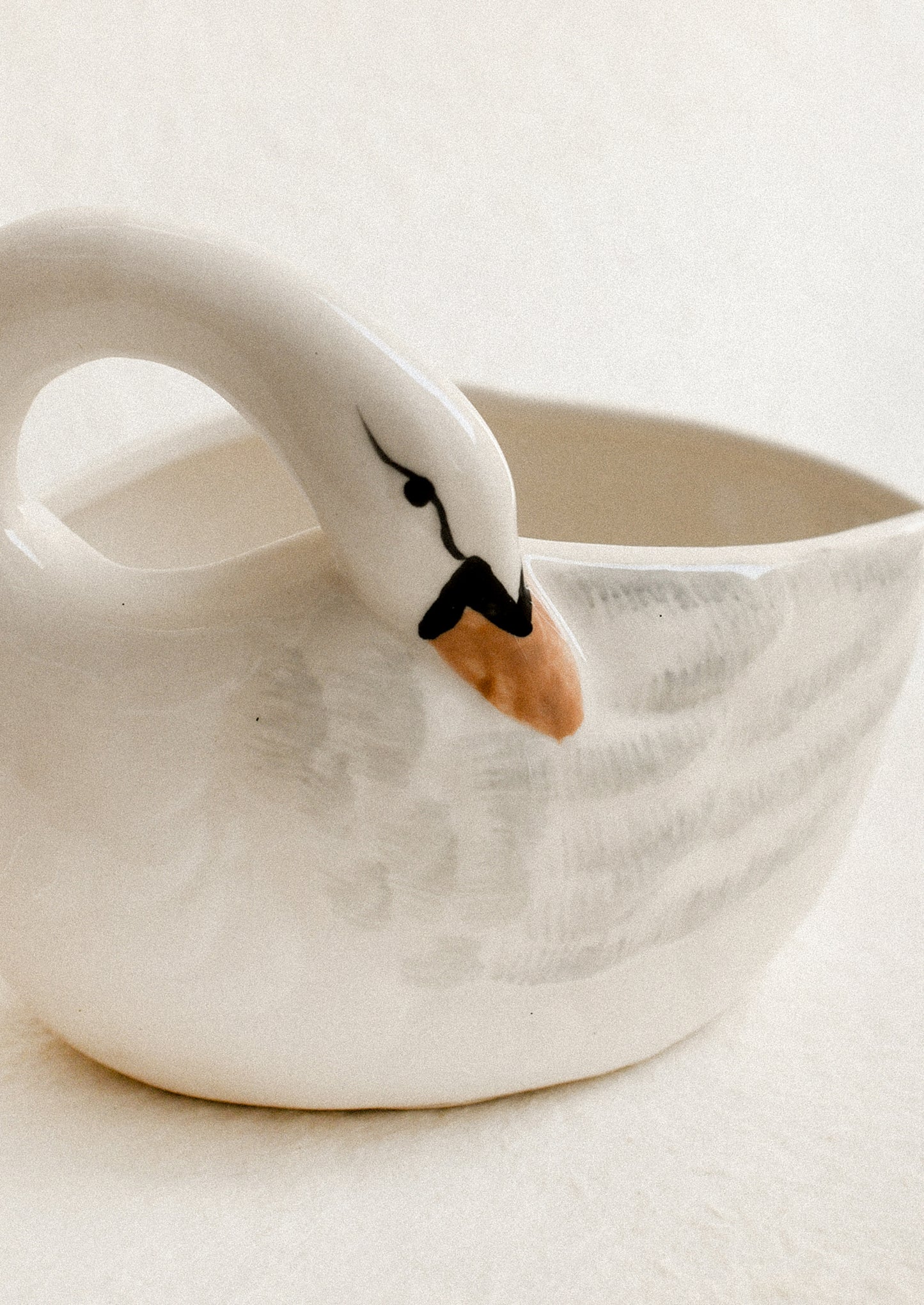 Ceramic swan-shaped bowl on a light background