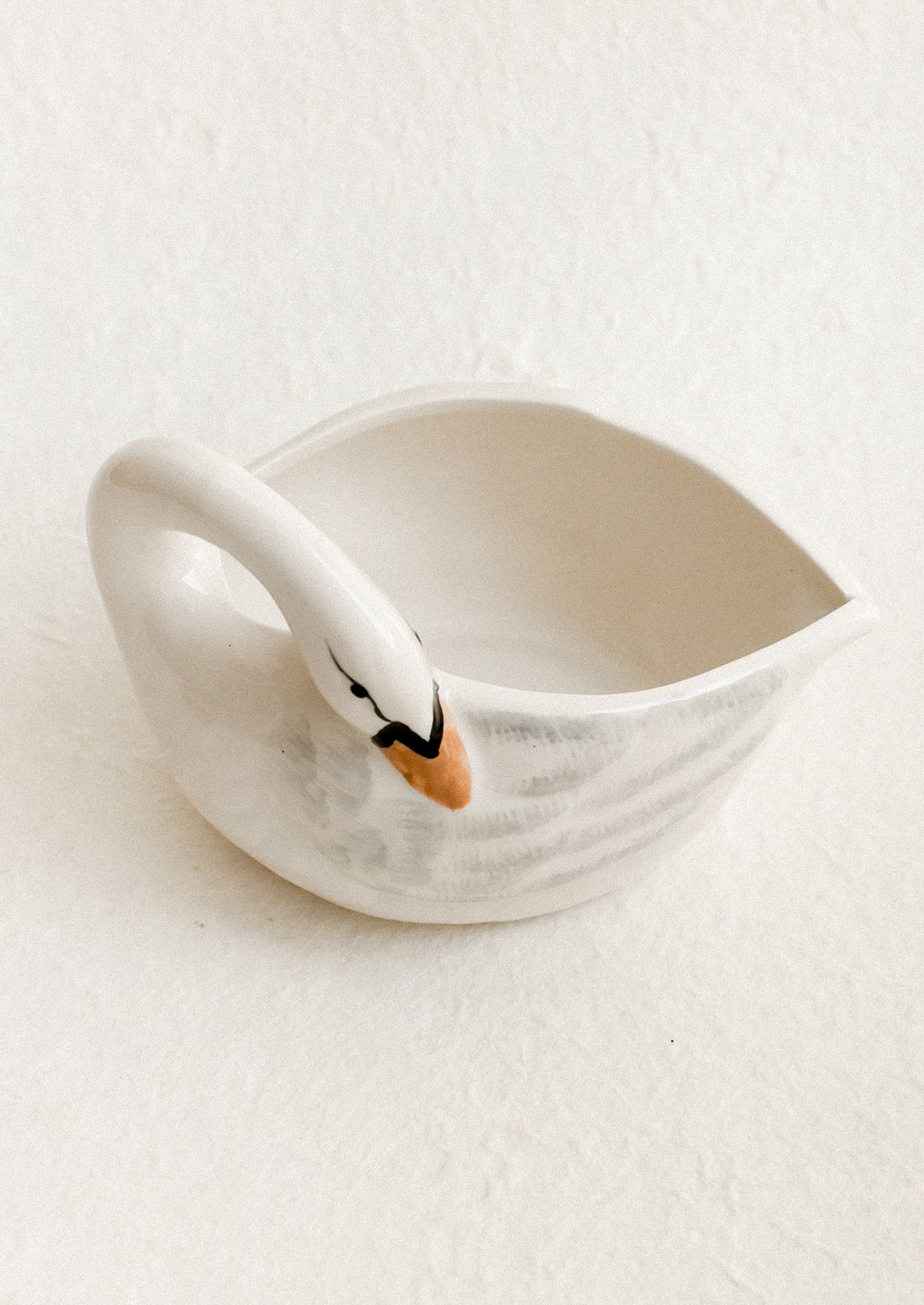 Ceramic swan-shaped bowl on a white background