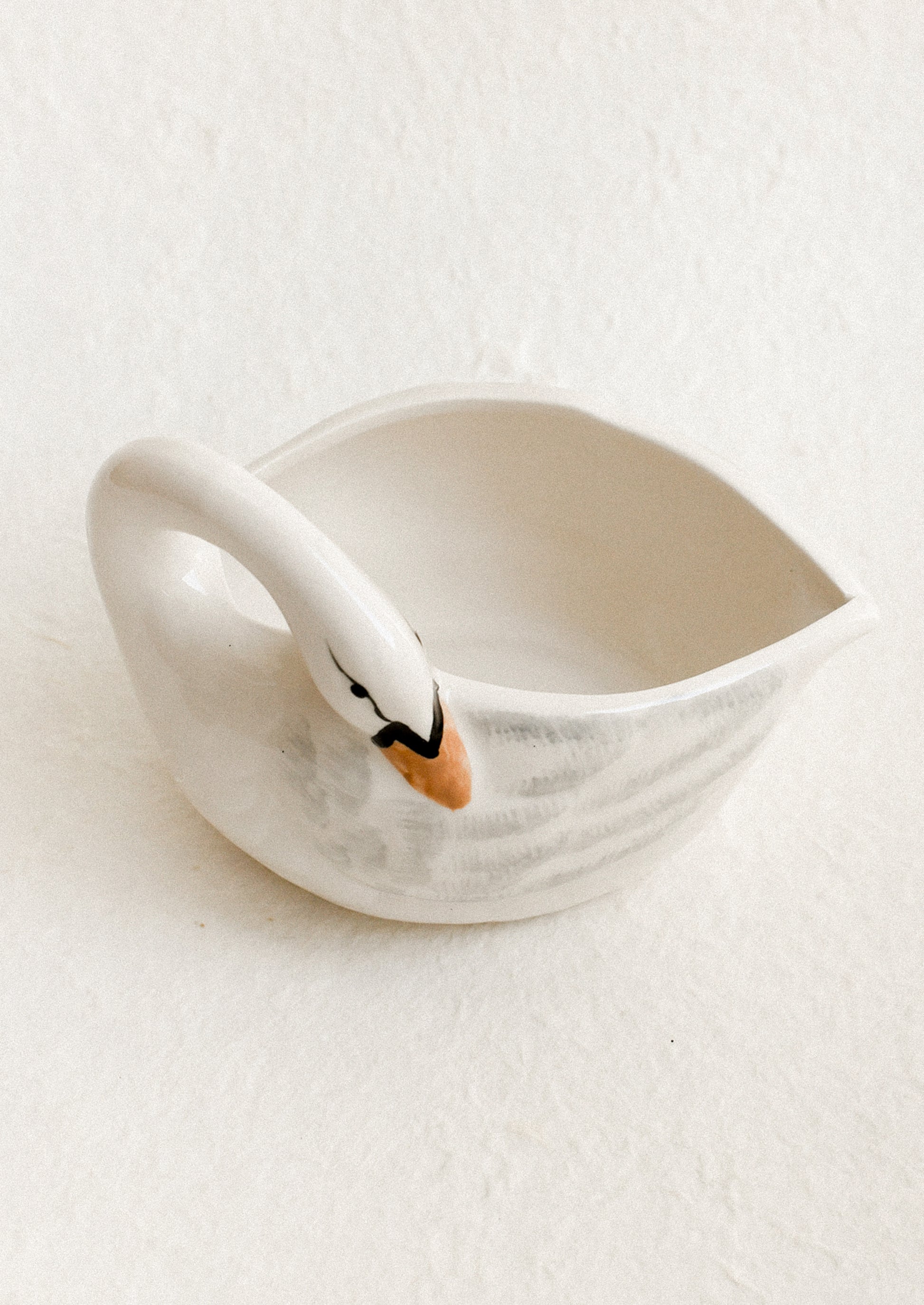 Ceramic swan-shaped bowl on a white background