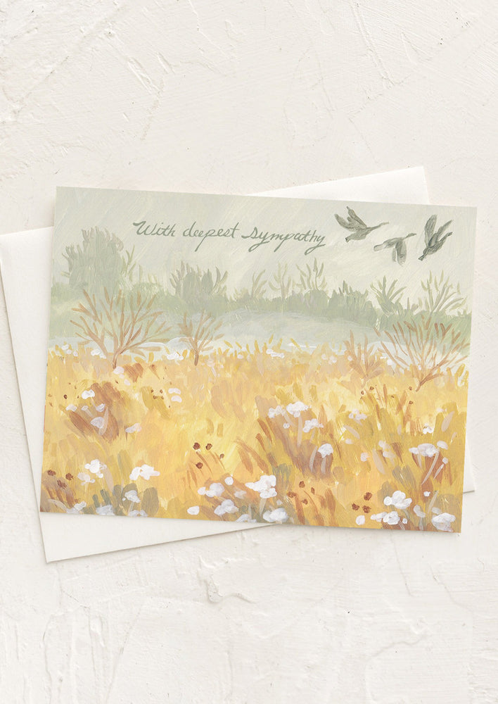 A card with illustration of geese flying over a field, text reads "With deepest sympathy".