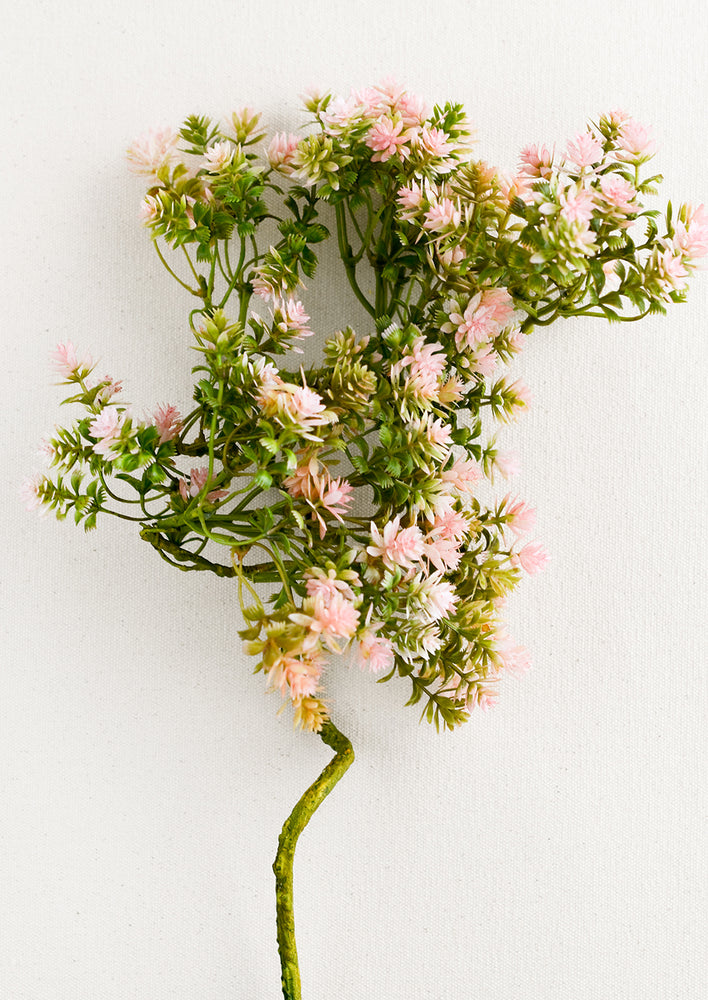 1: A faux branch of green sedum with pink tips.