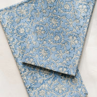 Cornflower Multi: A pair of blue and white colored napkins with floral print.